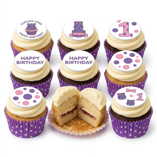 Cupcakes with cream frosting, purple wrappers, hippo, polka dot, and "Happy Birthday" toppers, with a number '1' topper.