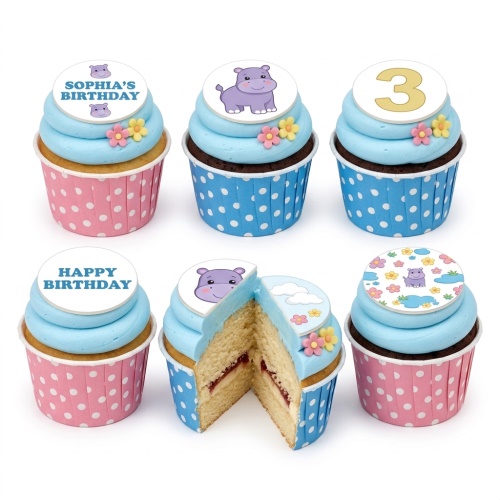 Hippo themed birthday cupcakes with blue frosting, pink and blue wrappers, and a custom age topper.