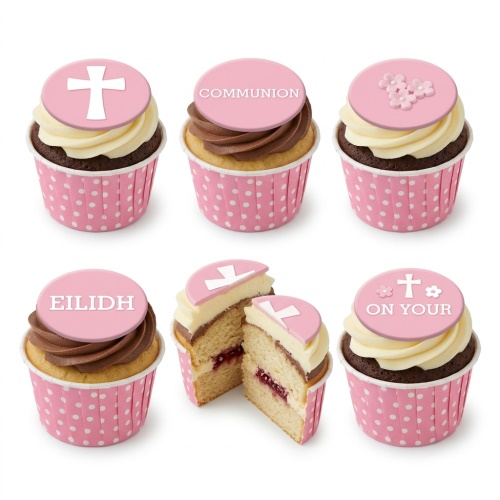 Pink Holy Communion cupcakes with white cross and floral fondant toppers, some with custom text.