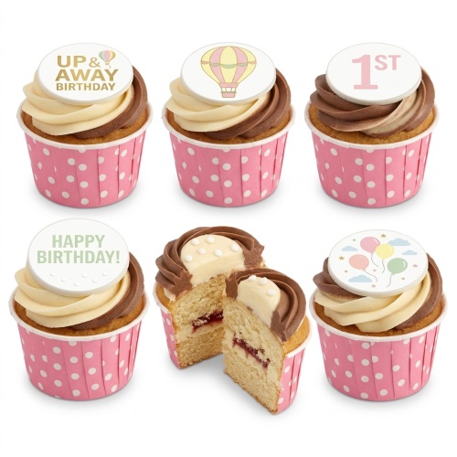 Pink polka dot cupcakes with hot air balloon, balloon, and "1ST" edible toppers. Two-tone frosting.