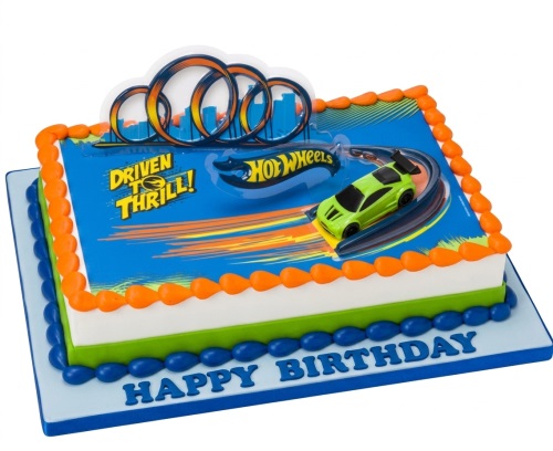 Rectangular Hot Wheels themed birthday cake with a green toy car on an edible track, orange and blue piping, and 'Happy Birthday' message.