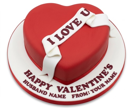 Red heart-shaped Valentine's Day cake with a white 'I Love U' banner and a personalised message on the board.