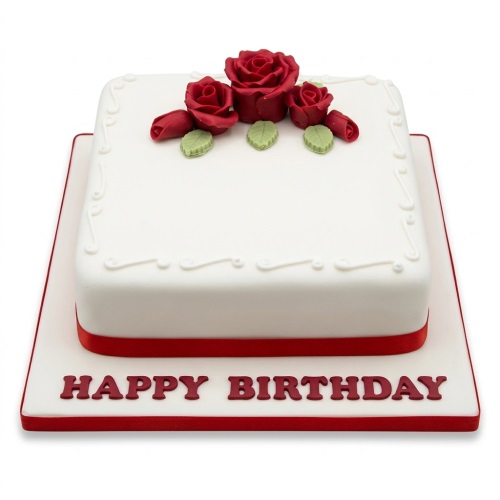 White square birthday cake with red sugar roses and green leaves on top, red ribbon, and 'Happy Birthday' message.