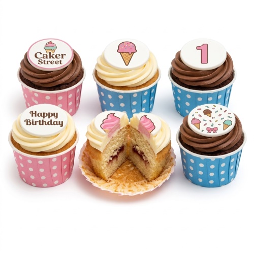 Assortment of birthday cupcakes with ice cream and sprinkle toppers in pink and blue polka dot cases.