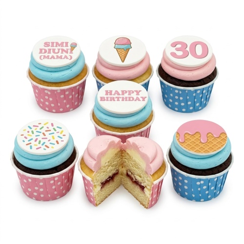 Ice cream cone and sprinkles themed birthday cupcakes with pink and blue frosting.