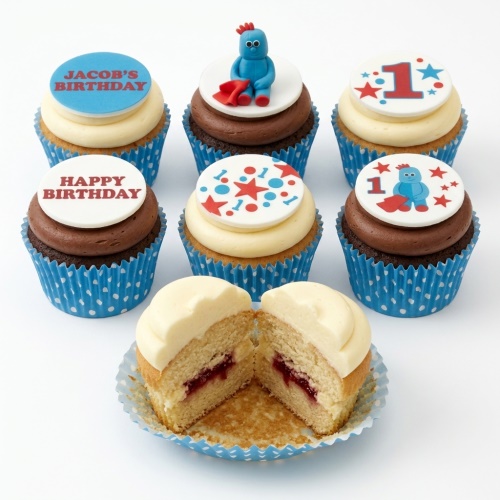 Igglepiggle themed 1st birthday cupcakes with blue and red decorations, number one toppers, and custom messages.
