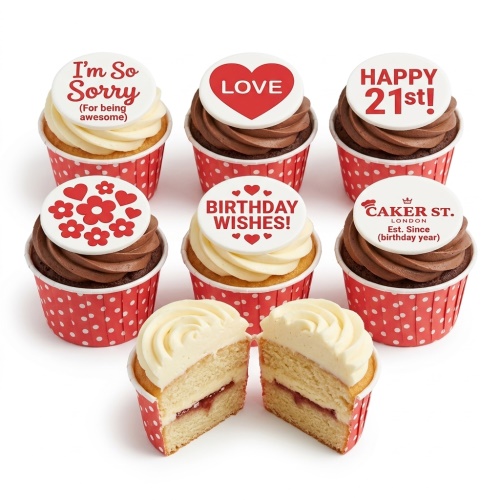 Assortment of adult birthday cupcakes with custom age and message toppers in red and white.