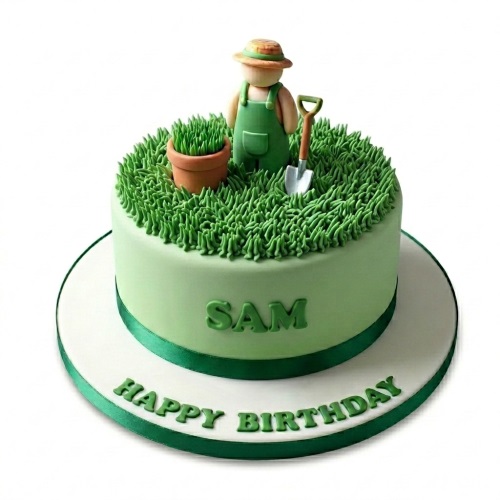 Round light green cake with green grass icing, a gardener figure, pot, and spade on top.