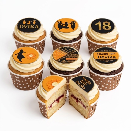 Cupcakes with orange and black toppers featuring Indian dance silhouettes, traditional patterns, and custom age.