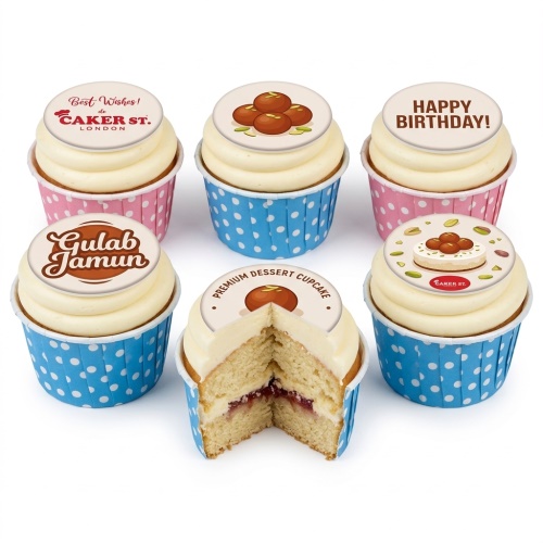 Six Gulab Jamun themed cupcakes with white frosting, blue and pink polka dot wrappers, and edible toppers.