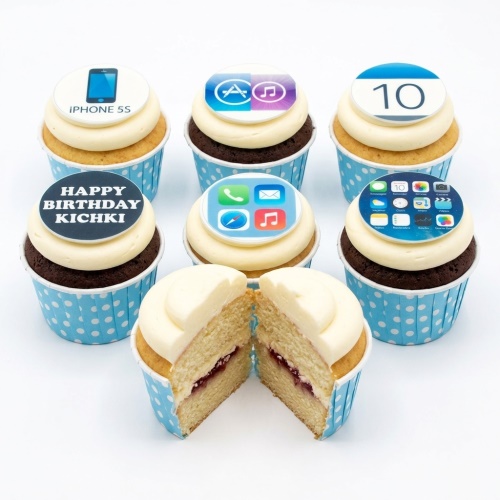 Assortment of iPhone theme birthday cupcakes with app icons, Apple logo, and custom age topper.