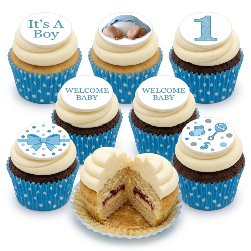 Cupcakes with blue and white baby boy themed toppers, including baby feet, bow, 'It's A Boy', and 'Welcome Baby' messages.