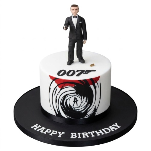 Round white James Bond 007 theme birthday cake with agent figure and gun barrel design.