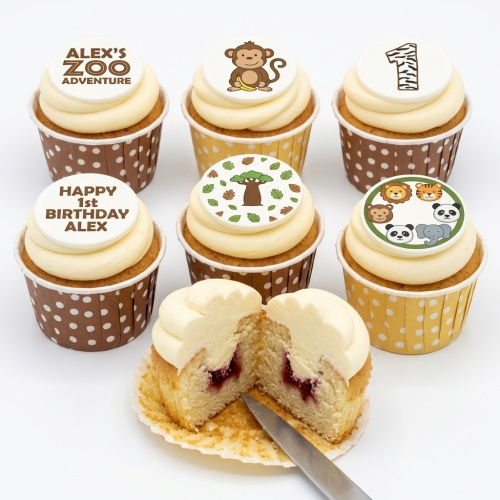 Vanilla cupcakes with cream frosting and edible jungle animal and tree toppers, with custom age and message examples.