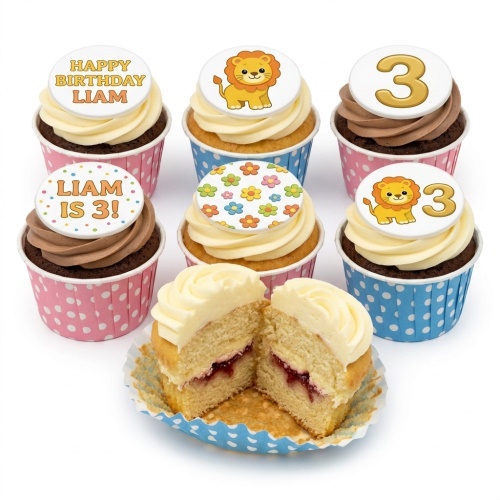 Assortment of lion and floral themed birthday cupcakes with custom age toppers and polka dot cases.