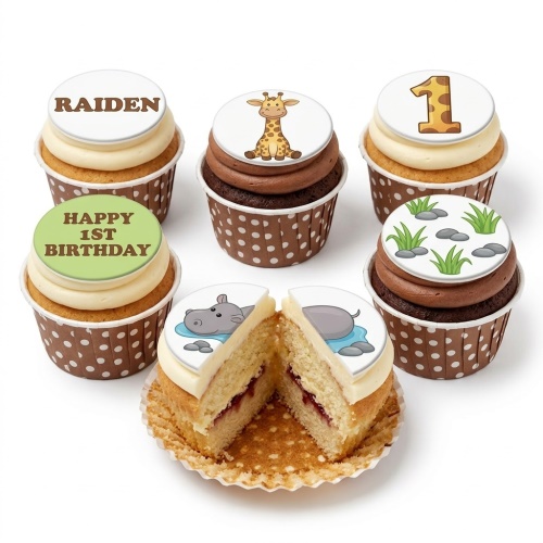 Jungle animal themed cupcakes with giraffe, hippo, grass, and custom age topper.