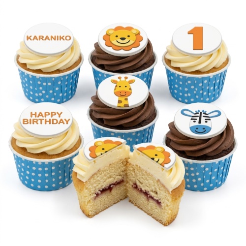 Jungle animal themed cupcakes with lion, giraffe, and zebra toppers.