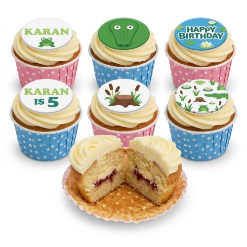 Jungle animal themed cupcakes with frog, crocodile, and pond life toppers in blue and pink cases.