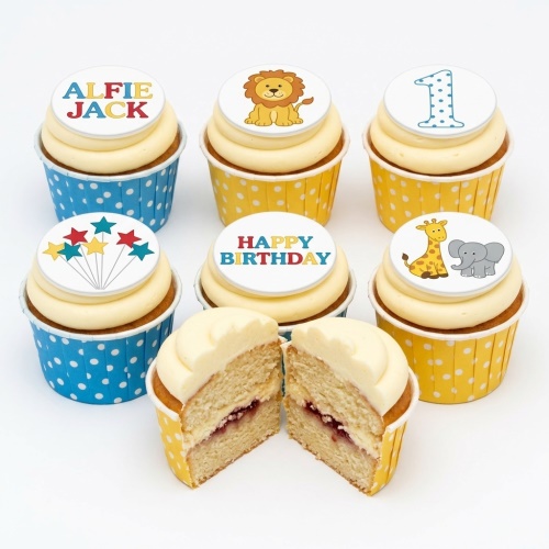 Jungle theme birthday cupcakes with lion, giraffe, elephant, stars, and custom age/name toppers.