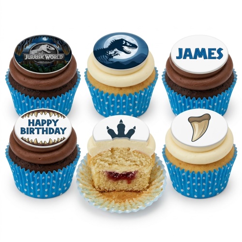 Assortment of Jurassic World and dinosaur themed cupcakes with chocolate and vanilla frosting.