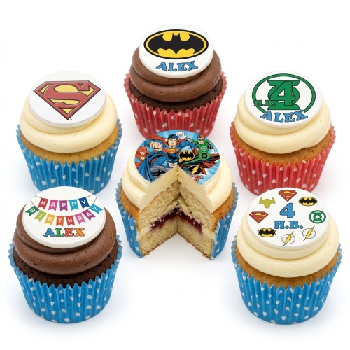 Assortment of superhero themed cupcakes with Batman, Superman, and Justice League toppers, some with custom age.