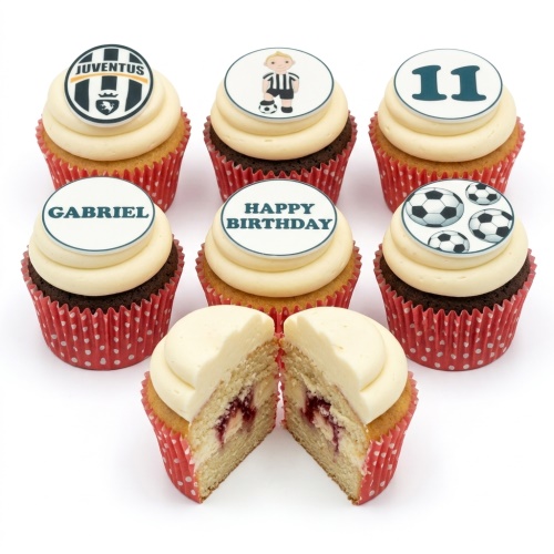 Football-themed cupcakes with white frosting, red polka dot cases, and edible toppers including footballs, a boy playing football, and a custom age.