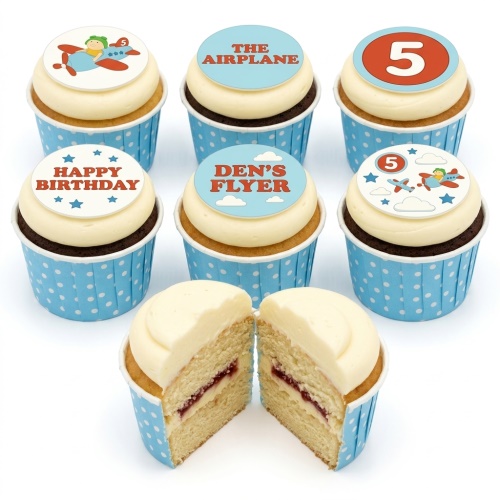 Vanilla and chocolate cupcakes with white icing and edible aeroplane themed toppers, some with a custom age and 'Happy Birthday' message.