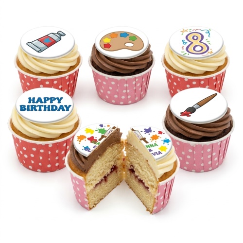 Cupcakes with art theme toppers including a paint tube, palette, brush, and a number 8.