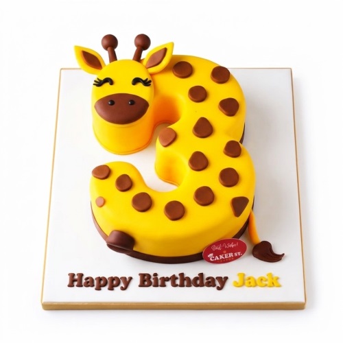 Yellow giraffe number cake with brown spots and 'Happy Birthday' message on the board.