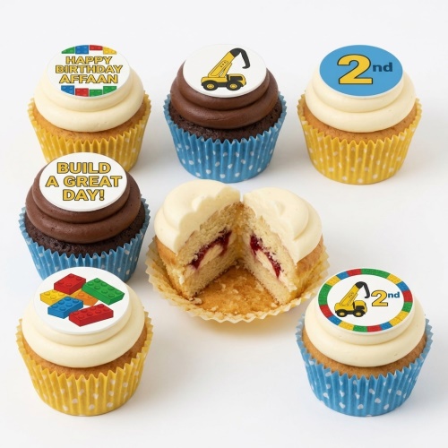 Cupcakes with construction digger and building block edible toppers, some with custom age and message.