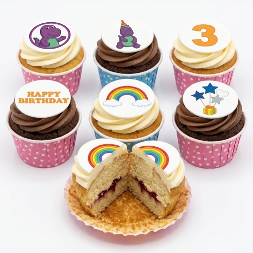 Barney dinosaur birthday cupcakes with rainbow, stars, and age topper