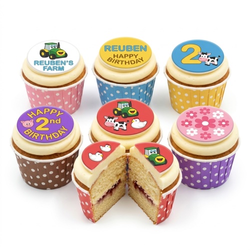 A set of farm animal and tractor themed birthday cupcakes with custom age and name toppers.