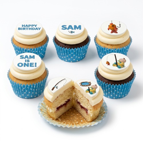 Fishing theme cupcakes with edible toppers featuring a boy fishing, a fishing rod, and an orange fish.