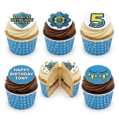 Set of Beyblade themed cupcakes with various edible toppers including Beyblade logos, a gear symbol, a monster face, and a custom age number.