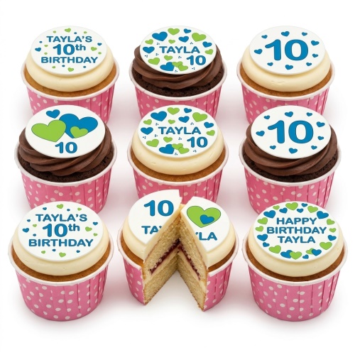 Cupcakes with white frosting and edible toppers featuring blue and green hearts, custom age, and personalised name.