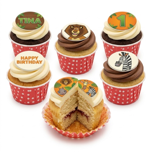 Assortment of jungle animal birthday cupcakes with custom age and name toppers.