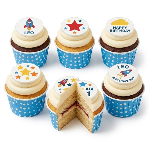 Six cupcakes with white frosting and blue polka dot wrappers, topped with edible rocket and star decorations.