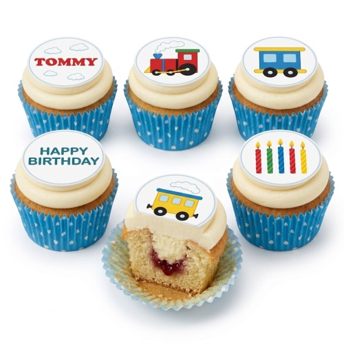 A set of vanilla cupcakes with white frosting, decorated with colourful train-themed edible toppers and "Happy Birthday" message.