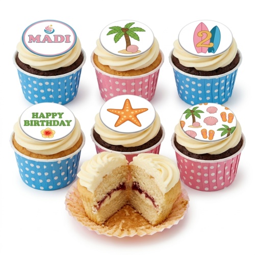 Tropical beach theme birthday cupcakes with palm trees, surfboards, starfish, and personalised toppers.
