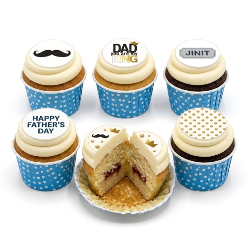 Six cupcakes with white frosting, blue polka dot cases, and toppers including a mustache, crowns, 'DAD you are my KING', 'Happy Father's Day', and a custom name.