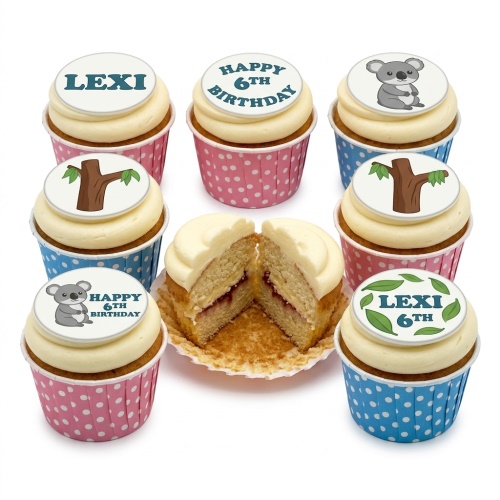 A selection of koala and tree themed birthday cupcakes with custom age and name toppers in pink and blue wrappers.