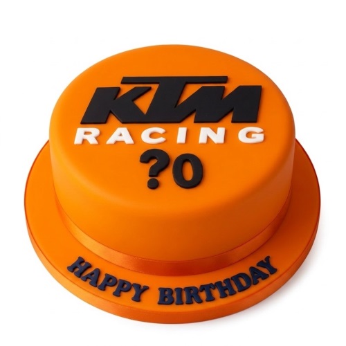 Orange KTM Racing themed birthday cake with custom age and "Happy Birthday" message.