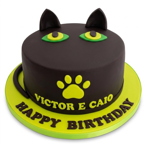 Round black cat birthday cake with green eyes, paw print, and custom message.