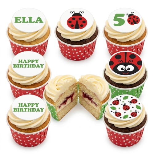 Ladybug themed birthday cupcakes with white frosting, red and green wrappers, and custom age and name toppers.
