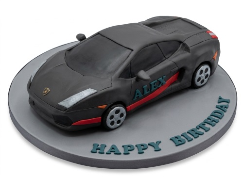3D sculpted dark grey Lamborghini sports car birthday cake with red stripe and 'Happy Birthday' message.