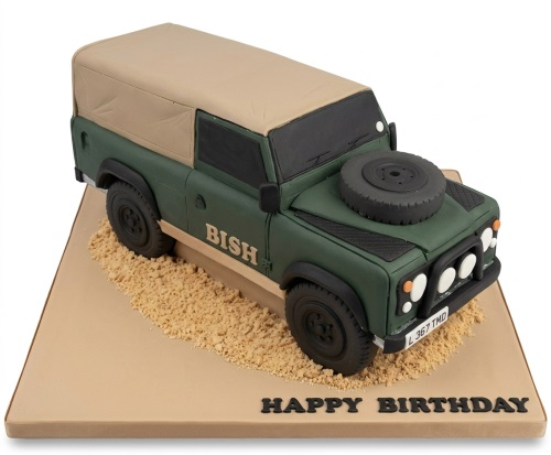 3D Land Rover Defender birthday cake in green and tan with a spare wheel and personalised message.
