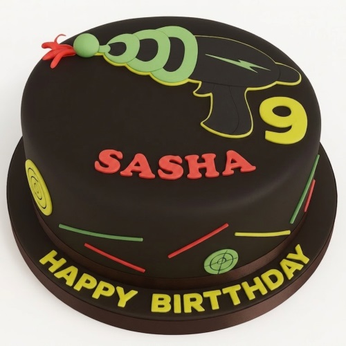 Round dark birthday cake with green ray gun, personalised name, custom age topper, and "Happy Birthday" message.