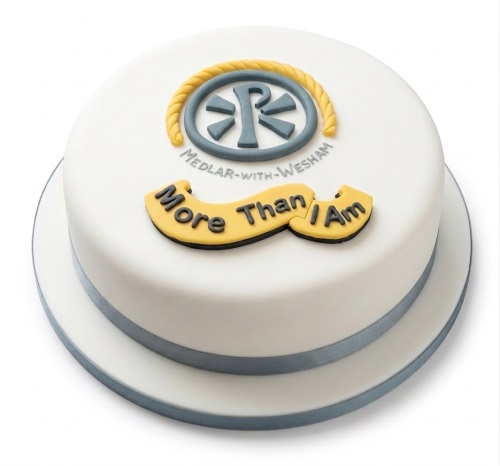 White round cake with custom company logo and personalised message banner.