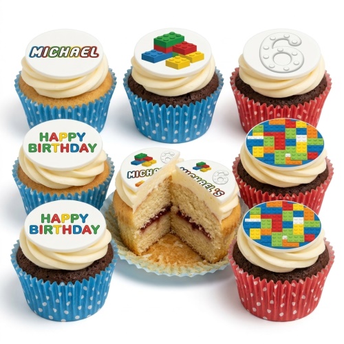 Assortment of cupcakes with building block themed toppers, including a custom name, age '6', and 'Happy Birthday' messages.