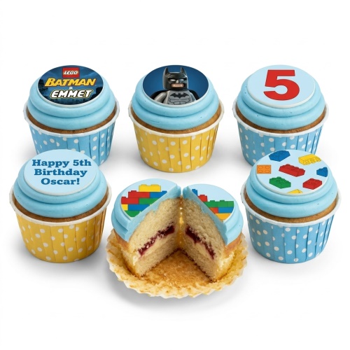 A set of Lego Batman and building block themed cupcakes with blue frosting and custom age topper.